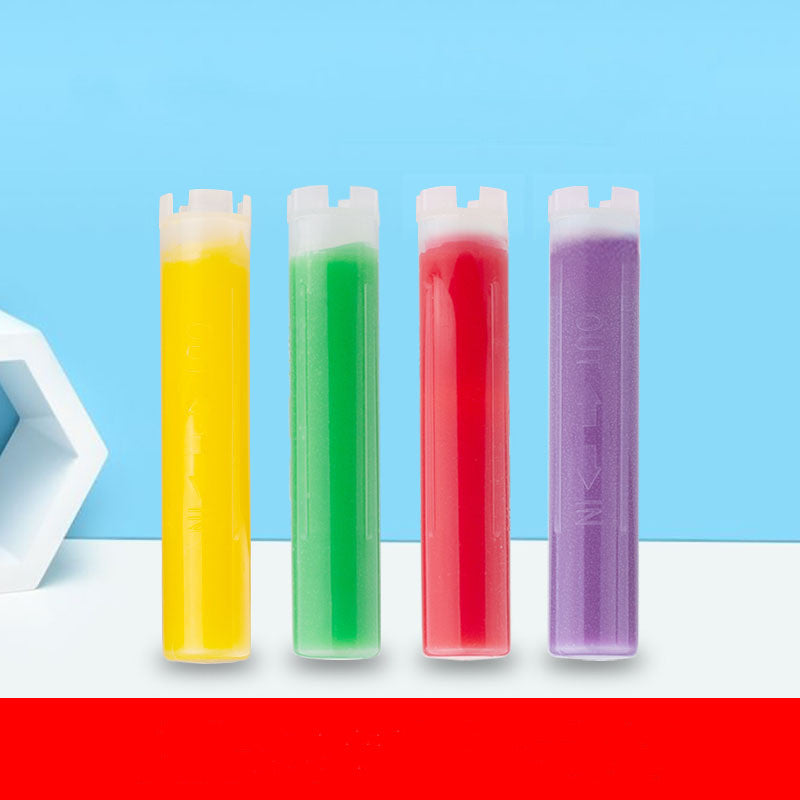 Four colorful ice pop sticks with different colored liquids.