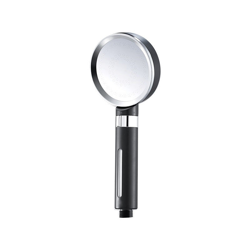 Handheld shower head with black handle and silver nozzle.