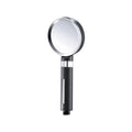Handheld shower head with black handle and silver nozzle.